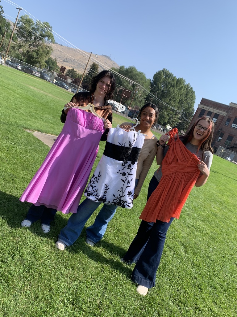 Chloe, Evyette and Mareisa, seniors at Lakeview High School share some dresses from the already donated rack.